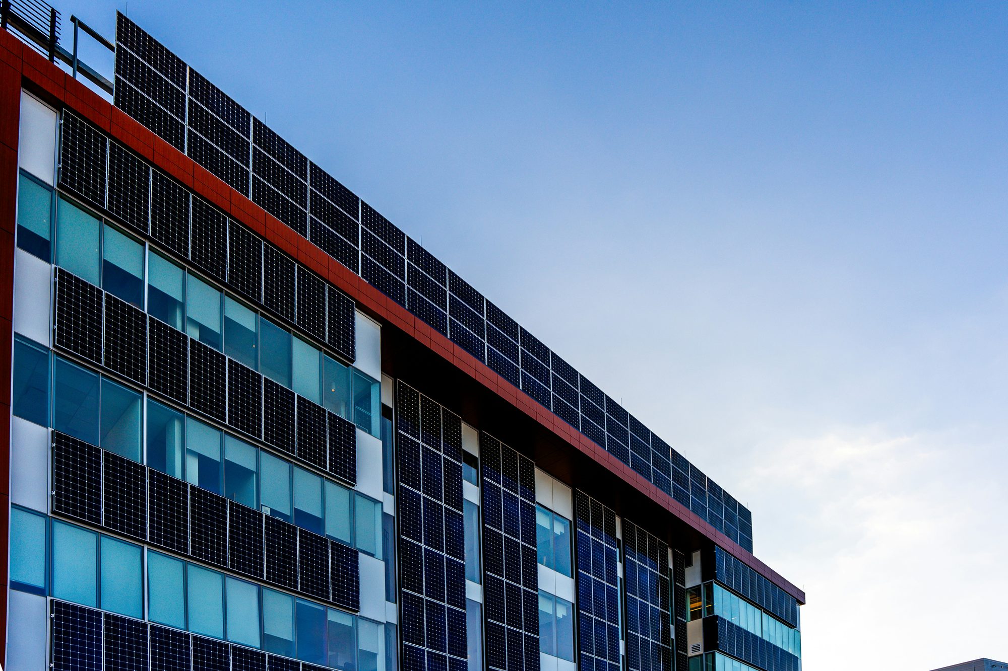 Modern building facade covered in solar panels