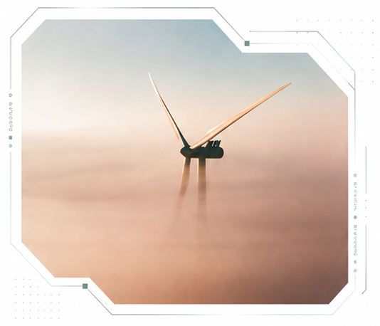 Offshore wind turbine rising through fog