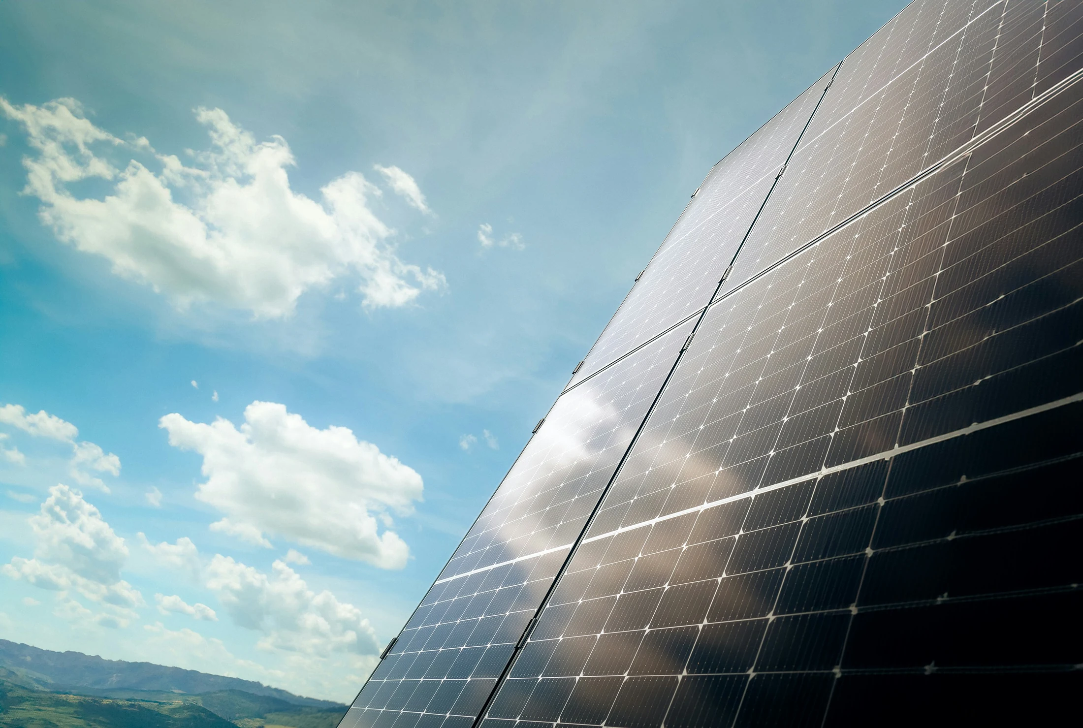 Solar panel array against a blue sky
